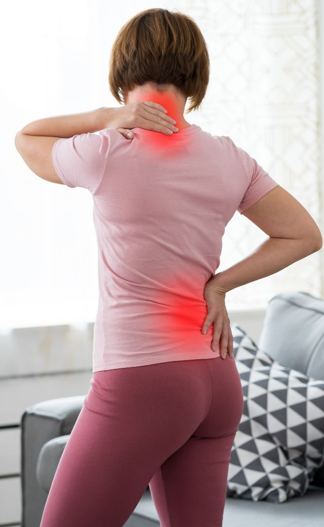 Pain Management Doctor Diagnosing Woman's Back